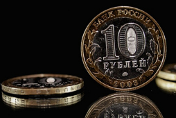 Давление на рубль сдерживают слабые позиции доллара